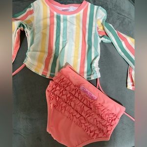 Never worn girls two piece Ruffle Butts long sleeve bikini! Size 6!